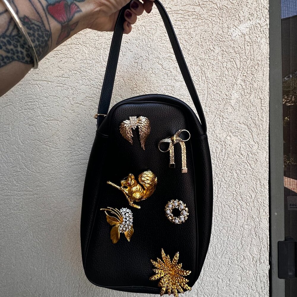 Statement Black Leather Toiletries Bag with Vintage Brooch Embellishments